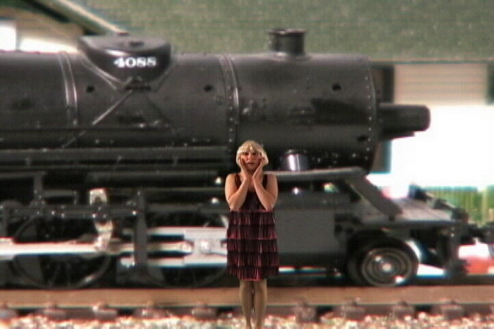 Cheryl in front of steam engine,train video,train video clip,railroad video,model railroad video,model train video,steam train video,free train video,steam trains video clip,model train dvd,model railroad dvd